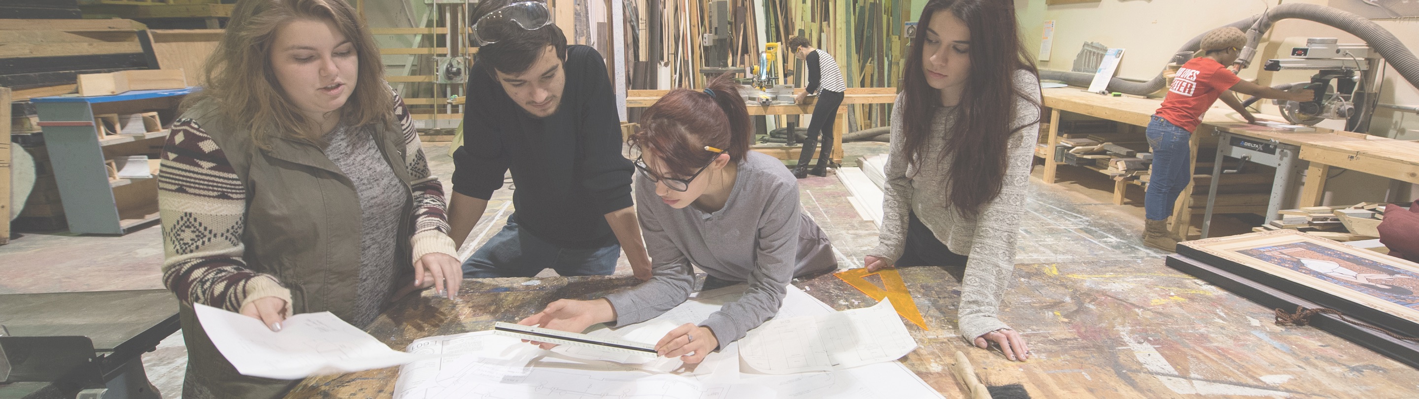 Students working on projects on table