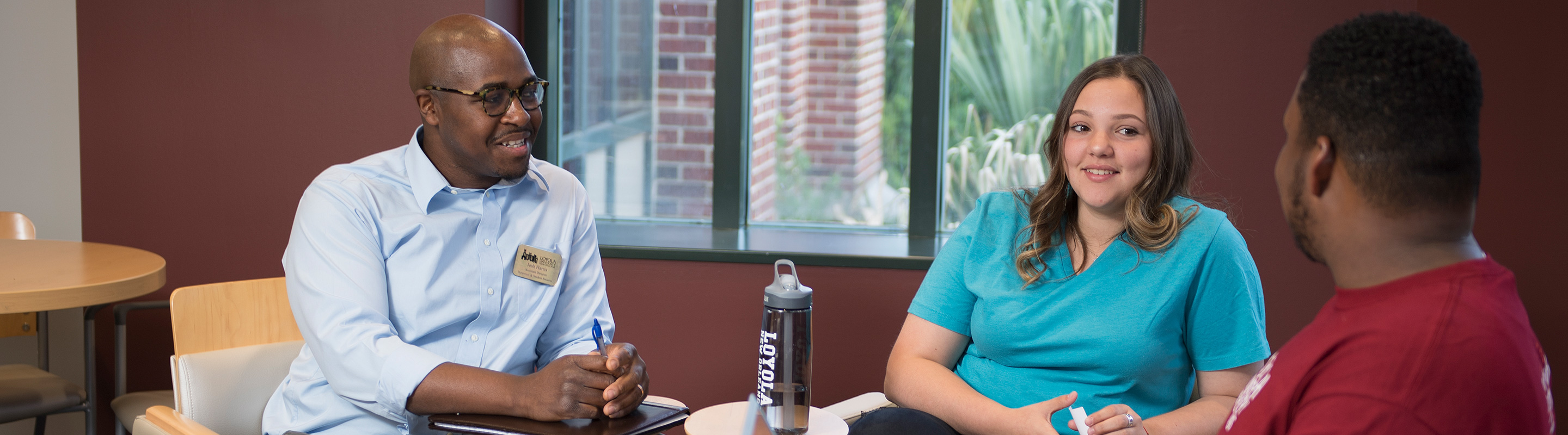 Two students working with a mentor