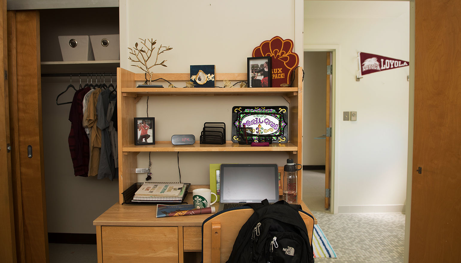 View of desk space and hallway in dorm