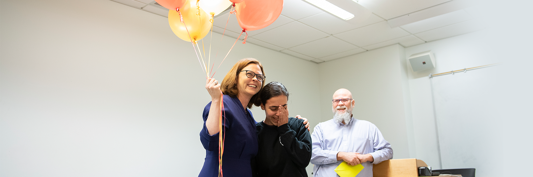 Rana receives Truman Fellowship and balloons from President Tetlow