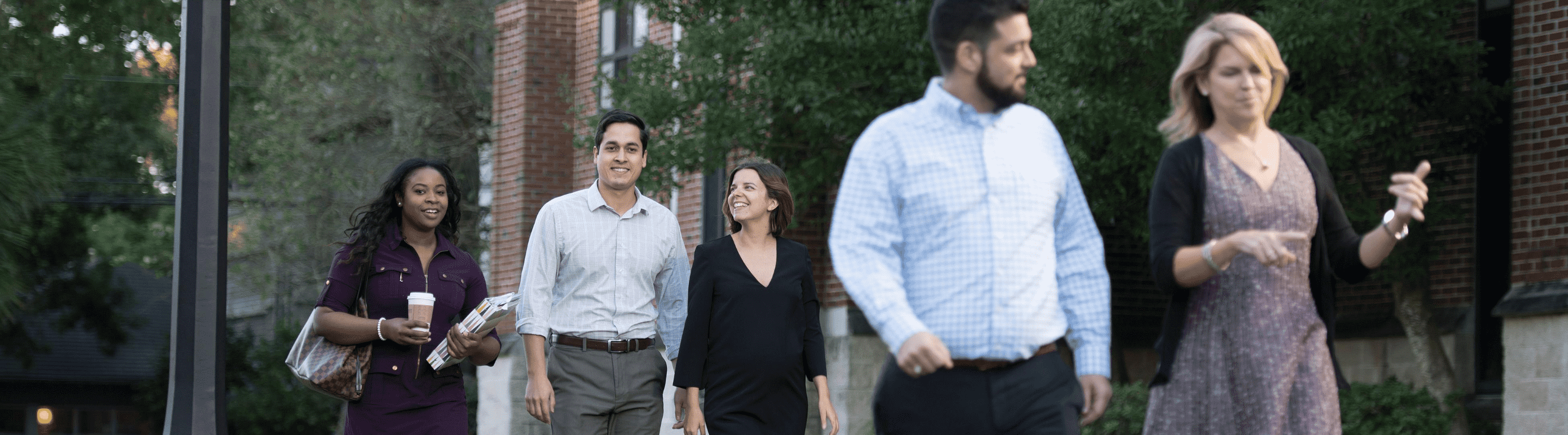 Graduate students walking around Loyola's campus.