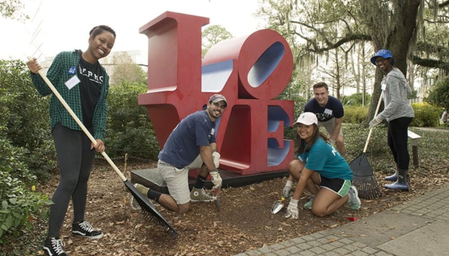 Graduate students  gardening during homecoming week
