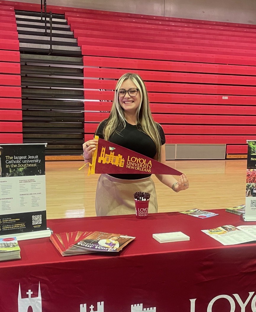 Trinity Williams Holding Loyola Flag at recruitment